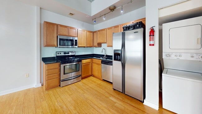Building Photo - Modern 1 BR w/ SS appliances at The Lofts ...