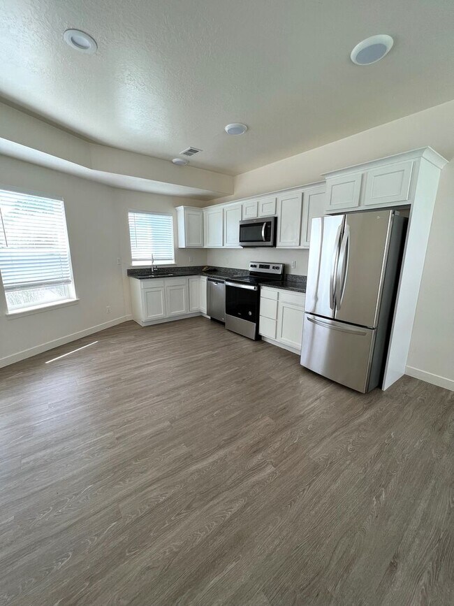 Building Photo - Up to 8 Weeks Rent Free | Modern 3-Bedroom Townhome with a 2-Car Garage & Private Balcony in Clea...