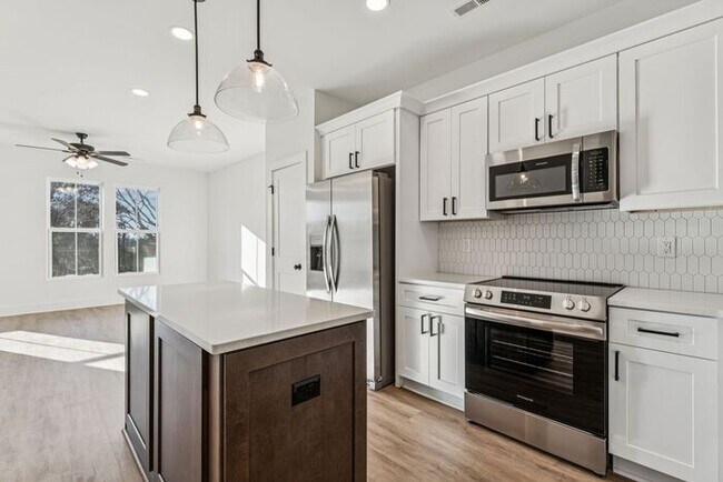 Building Photo - High-End 2BR Townhome | Rooftop Terrace + 2-Car Garage | 24-Unit Community