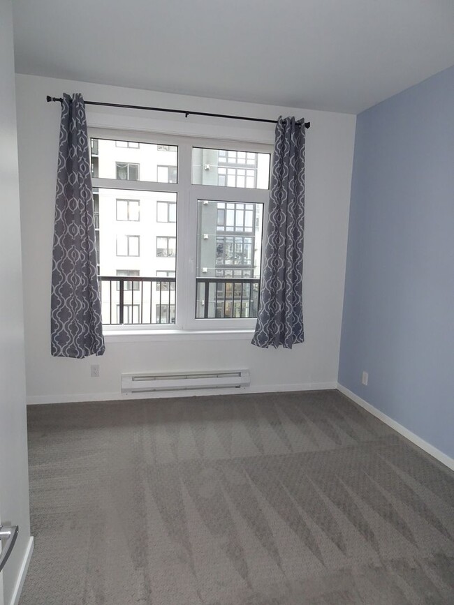 Building Photo - Chic 1-Bedroom Condo with Stunning City & ...