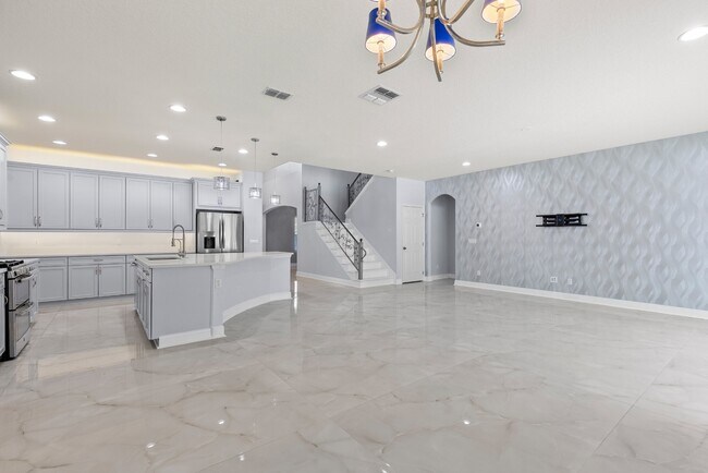 Building Photo - Spacious 6-Bedroom Home Near Lake Nona | 3-Car Garage + Tesla Charger