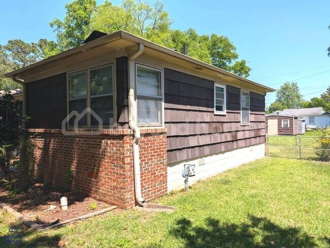 Building Photo - Updated Bungalow with Massive Deck and Fully Fenced Yard!