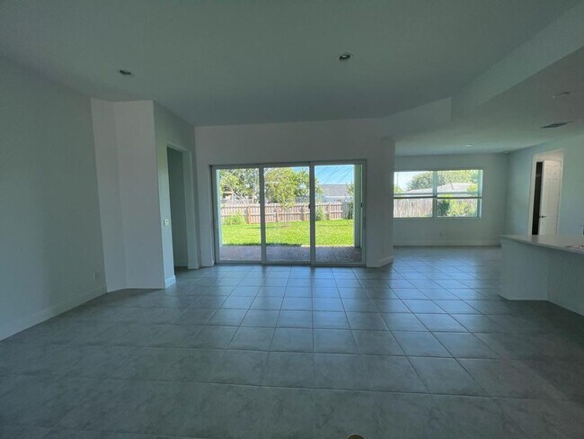 Building Photo - This Charming Brand-New Home is a 4/3 with...