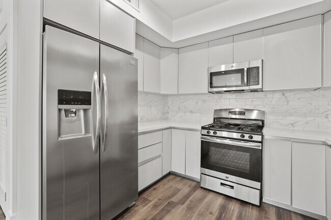 Kitchen with Stainless-Steel Refrigerator, Stove, and Microwave Oven - Richland Metro by Wiseman