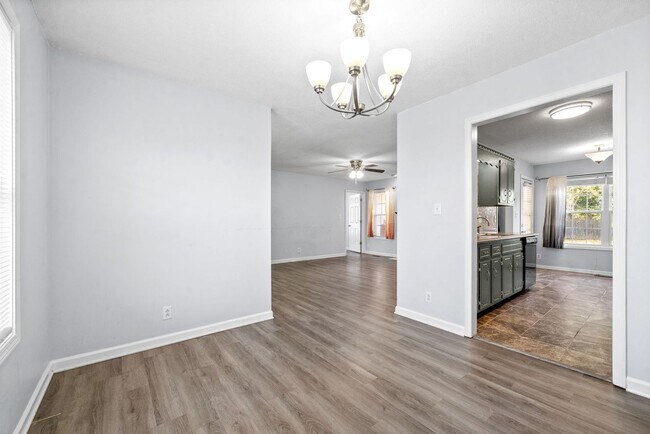 Building Photo - Adorable home with fenced back yard coming...