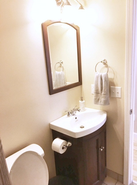 Bathroom with cherry cabinet/mirro - 1918 7th Ave