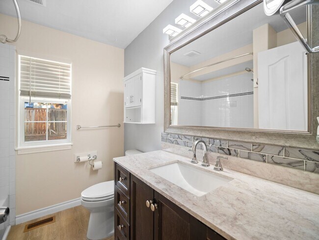Building Photo - Spacious Home with Fenced Yard & Garage – ...