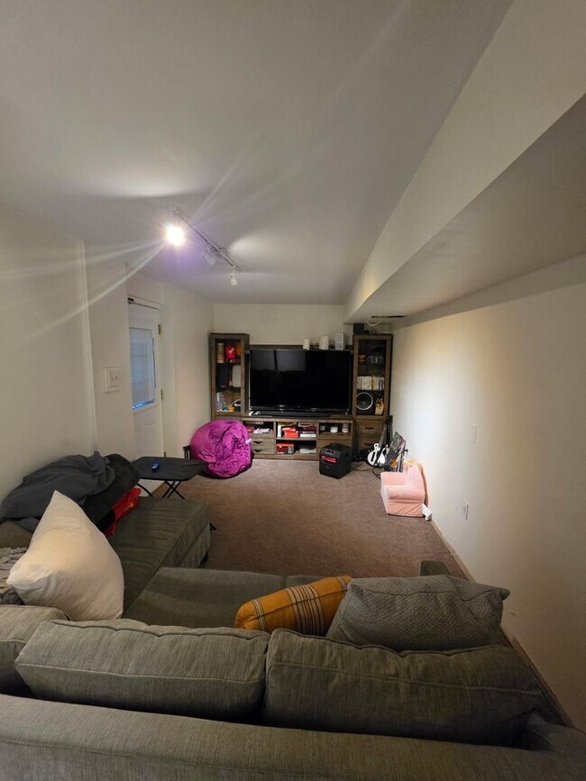Building Photo - Stunning 3–4 Bedroom Townhome in Private Community | Garage + EV Charger | Deck with Tree Views