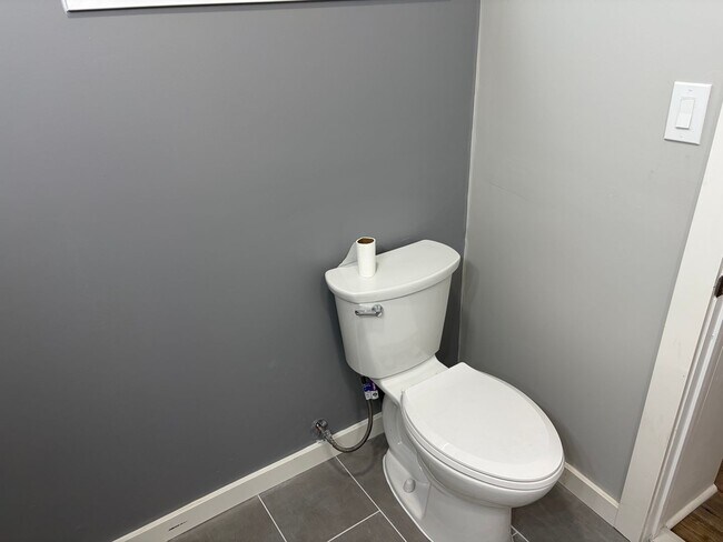 Building Photo - Newly Renovated 2- Story Townhome with Front Porch and Back Yard