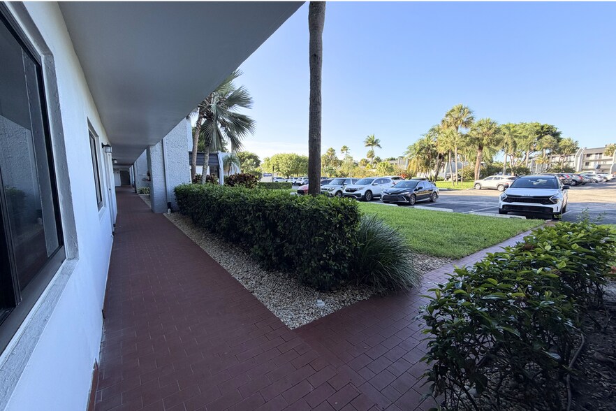 Pool house across the street from front door. - 4266 Deste Ct