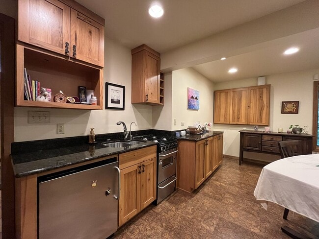 Building Photo - One-of-a-Kind Custom Home with Wall of Windows, Stone Fireplaces, Expansive Entertainment Space &...