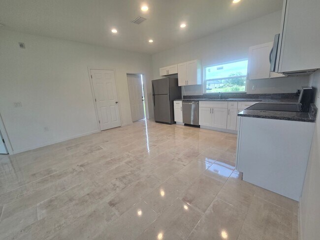 Building Photo - Brand New 3 BEDROOM 2 BATH AND ONE CAR GAR...