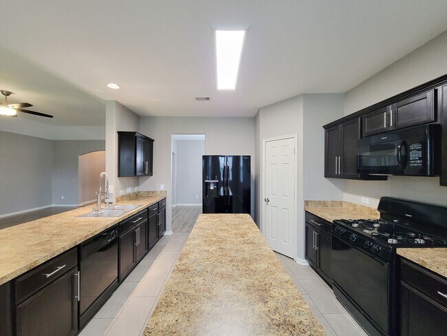 Building Photo - Welcome to this charming one-story home fe...