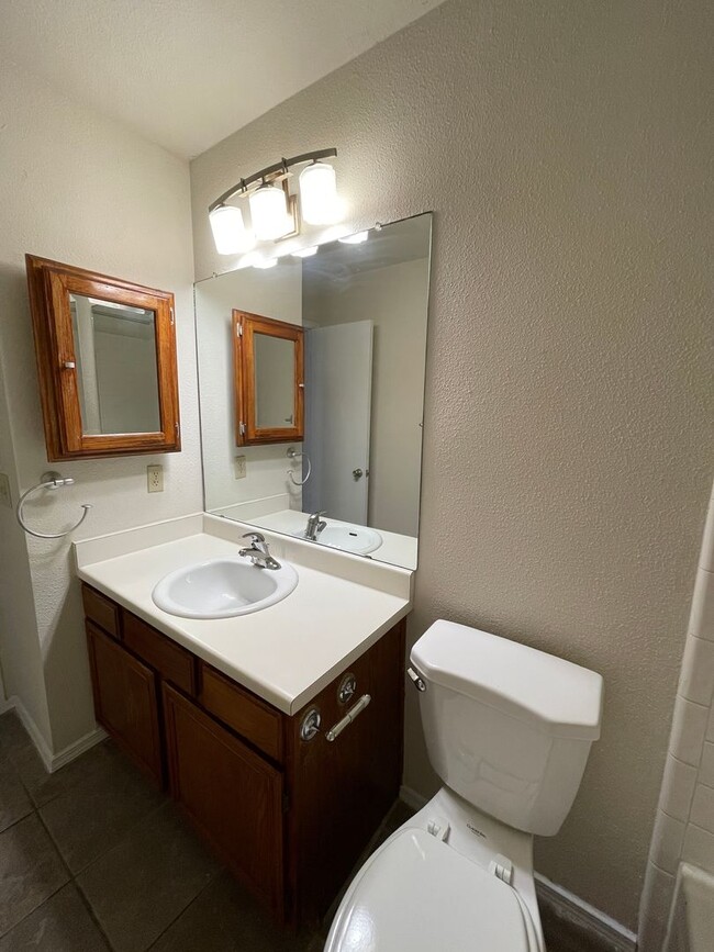 Building Photo - SPACIOUS HOME - NEW FLOORING! - 2 LIVING A...