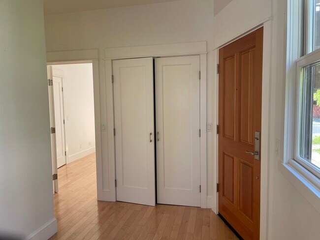 Entry storage closet, dining area by window, view to bedroom - 3918 Webster St