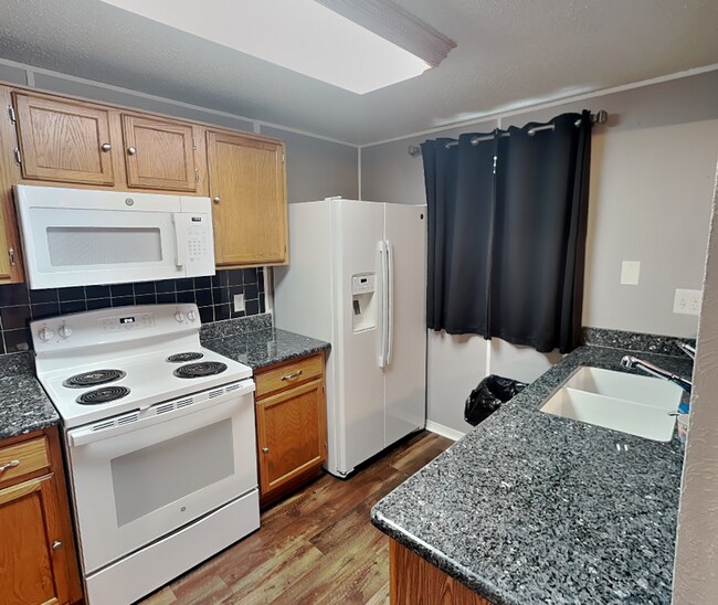 Building Photo - Charming One-Story with Bonus Sunroom & Backyard Retreat in Prime Summerfields Location!