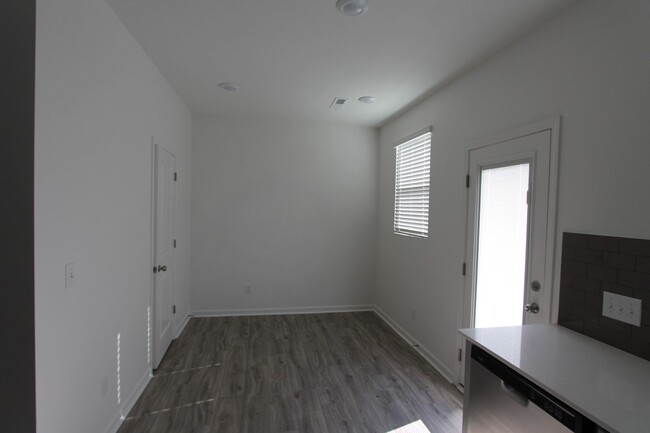 Building Photo - NEW 3 Bedroom Townhome Minutes from Downto...