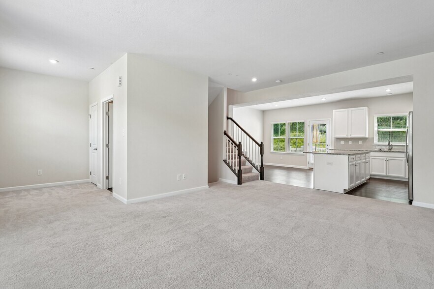 Family room looking into kitchen - PLAZA