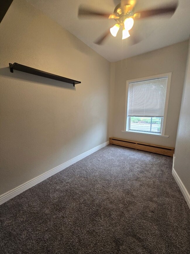 Building Photo - This updated and welcoming condo in the he...