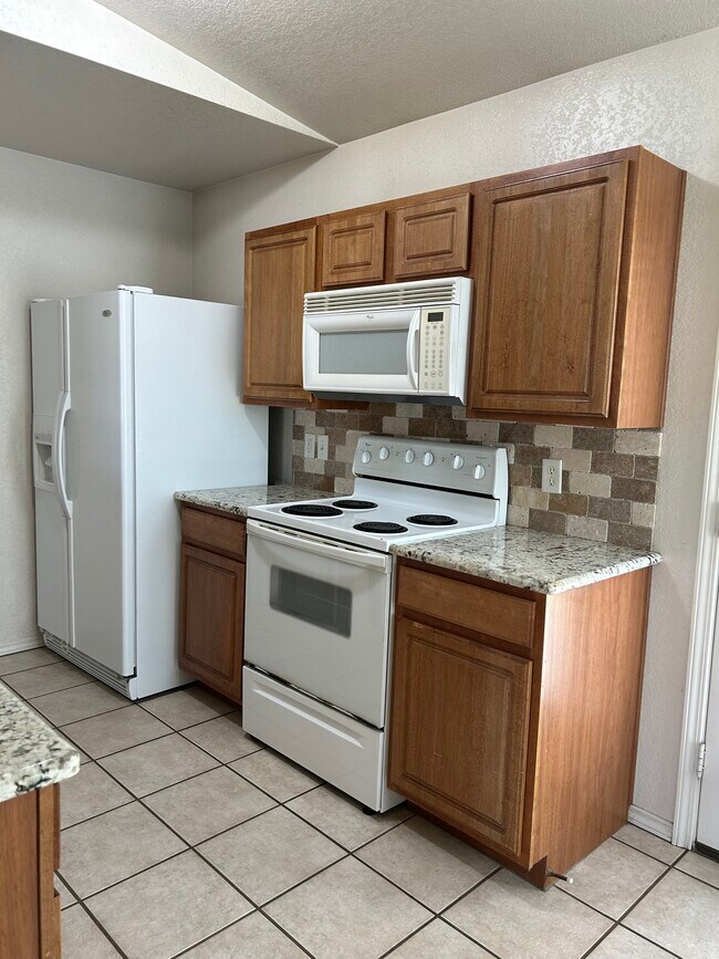 Kitchen with Granite - 9232 Snowberry Dr