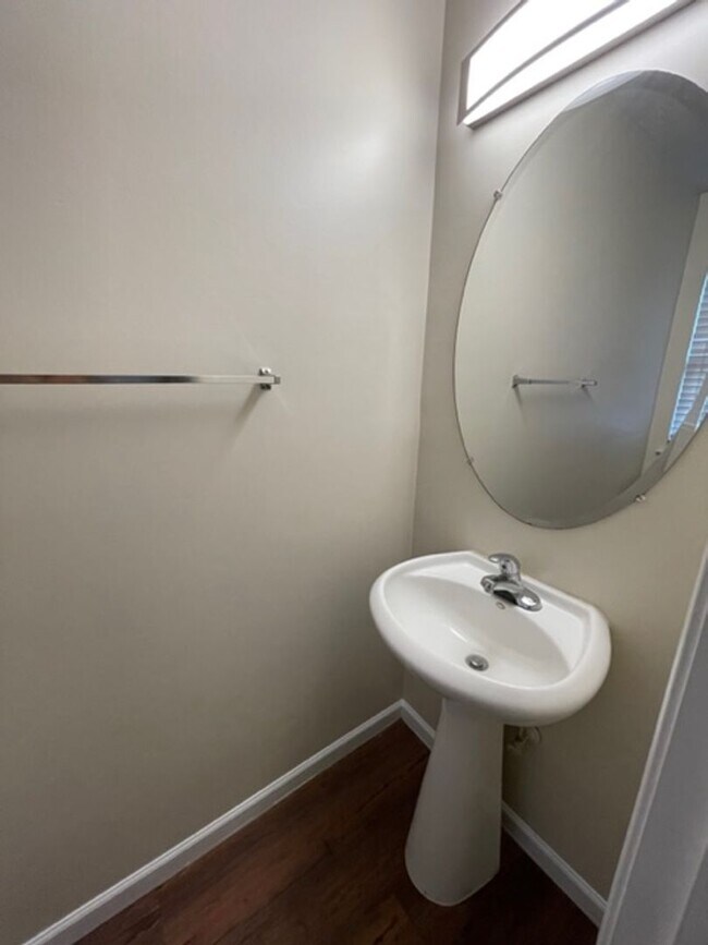 Building Photo - Must see this 4 bedroom 2.5 bath townhouse with 1 car garage .