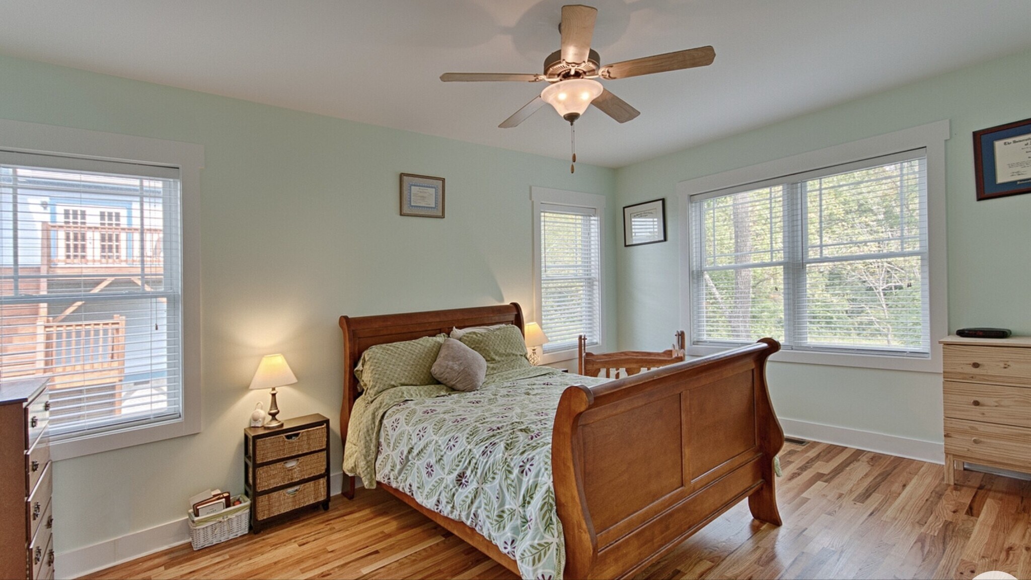 Primary bedroom with ceiling fan and private en suite bath - 144 Estelle Park Dr
