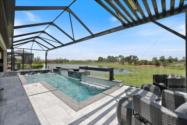 Building Photo - Luxury Home w/ Pool, Outdoor Kitchen, Car Lift, & Water View In Parrish!