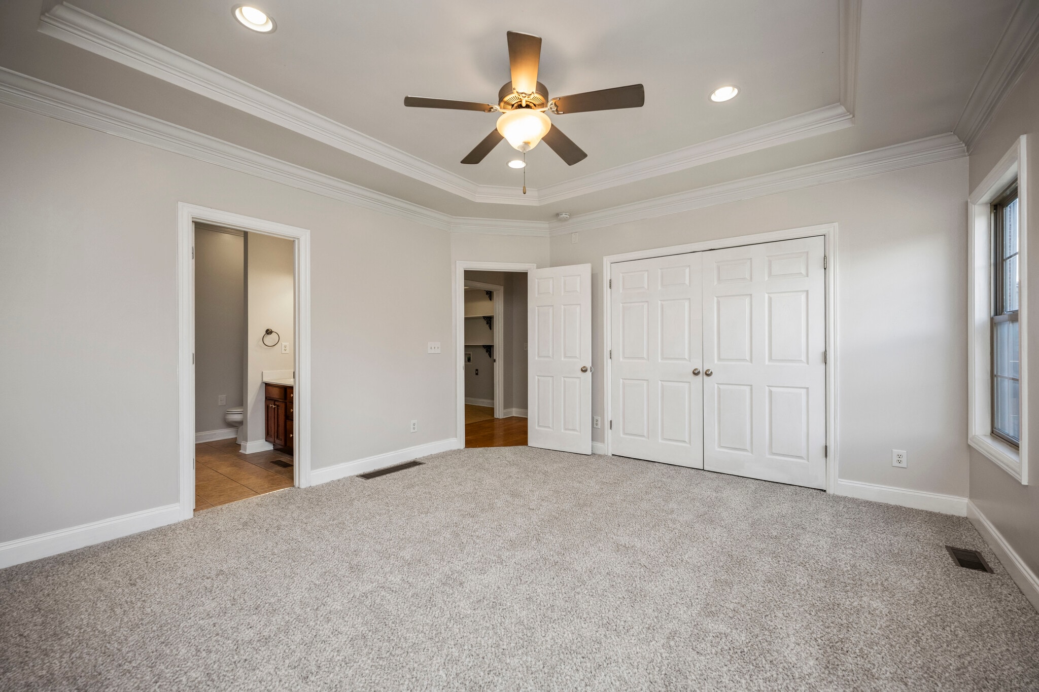 Primary Bedroom looking toward the onsuite Bathroom, Bedroom entrance and walk-in closet - 393 Hays Blvd