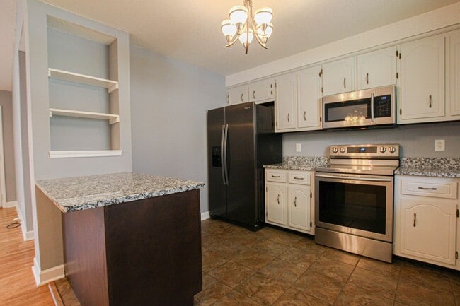 Building Photo - Pet Friendly Three Bedroom with Basement!