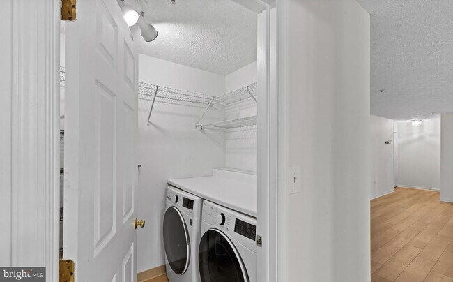 Building Photo - Welcome to Piney Orchard! This beautifully updated 2-bedroom, 2-bath condominium!