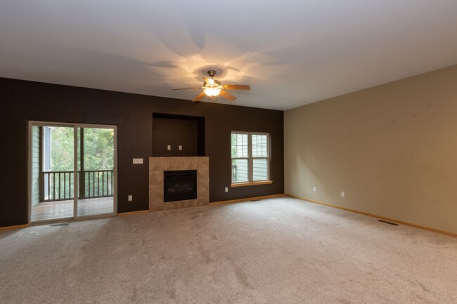 Living Room w/ access to Elevated Screened Patio - 1st Floor - 1894 N Dubuque Rd