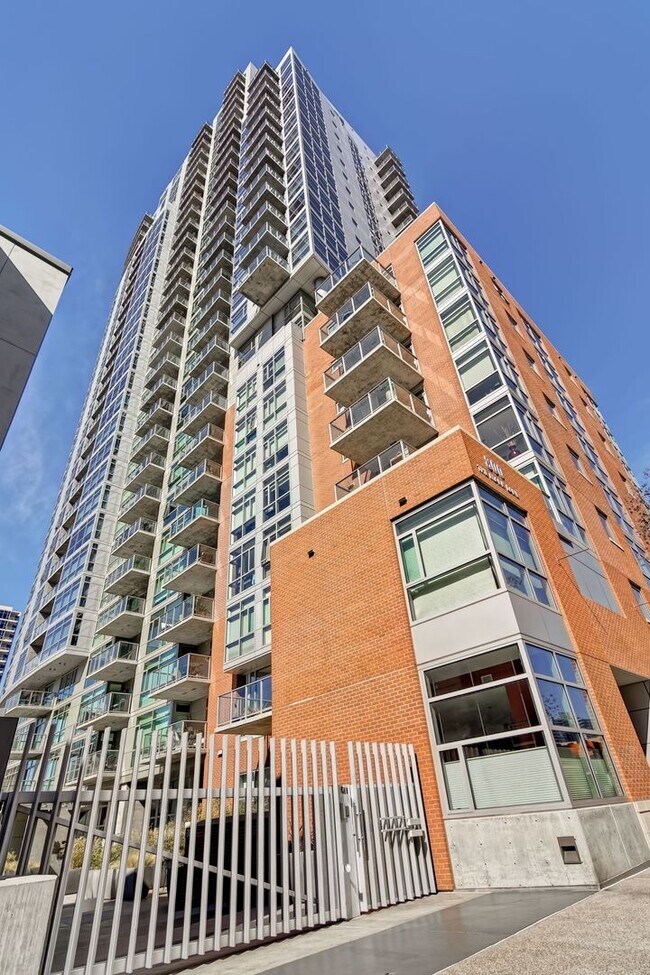 Building Photo - Modern Downtown Condo in Premier High-Rise...