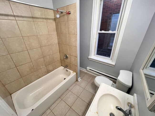 Building Photo - Updated 3 Bedroom 1.5 Bath Townhome w/ Paved Yard + Washer & Dryer