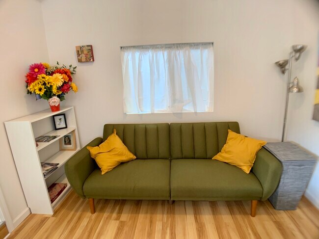 We moved the pull-out couch to the other wall and added a smart tv - 3405 NE 80th Ave
