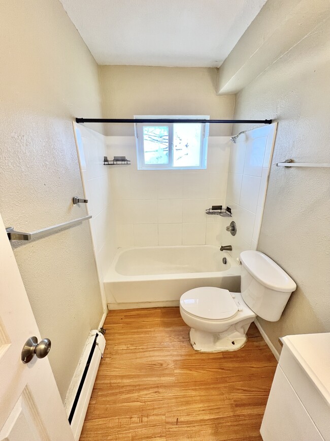 Step into this bright and clean bathroom, designed for relaxation and comfort. - 1690 Eaton