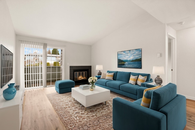Step into elegance with this chic, sunlit living room. - Monte Vista Apartments