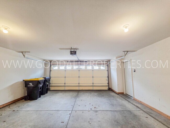 Building Photo - Bright & Spacious Waukee Townhome Near Dining, Shopping & Entertainment and attached 2-car garage