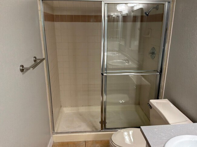 Building Photo - Condo 3 bedrooms 2 bathrooms 1 car garage gated subdivision.