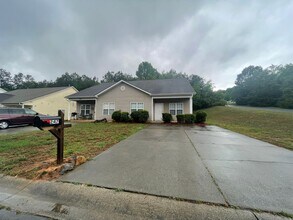 Building Photo - This two-story, 4-bedroom, 2-bath duplex in Fort Mill, SC sits on a corner lot