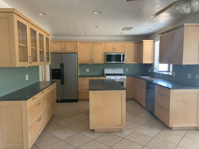Building Photo - Four Bedroom Home with Utilities included!