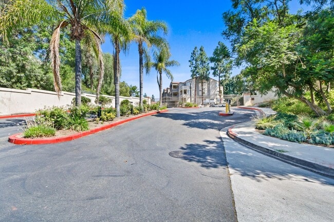 Building Photo - 1BR Condo with Private Balcony, Central A/C & Community Amenities in Corona
