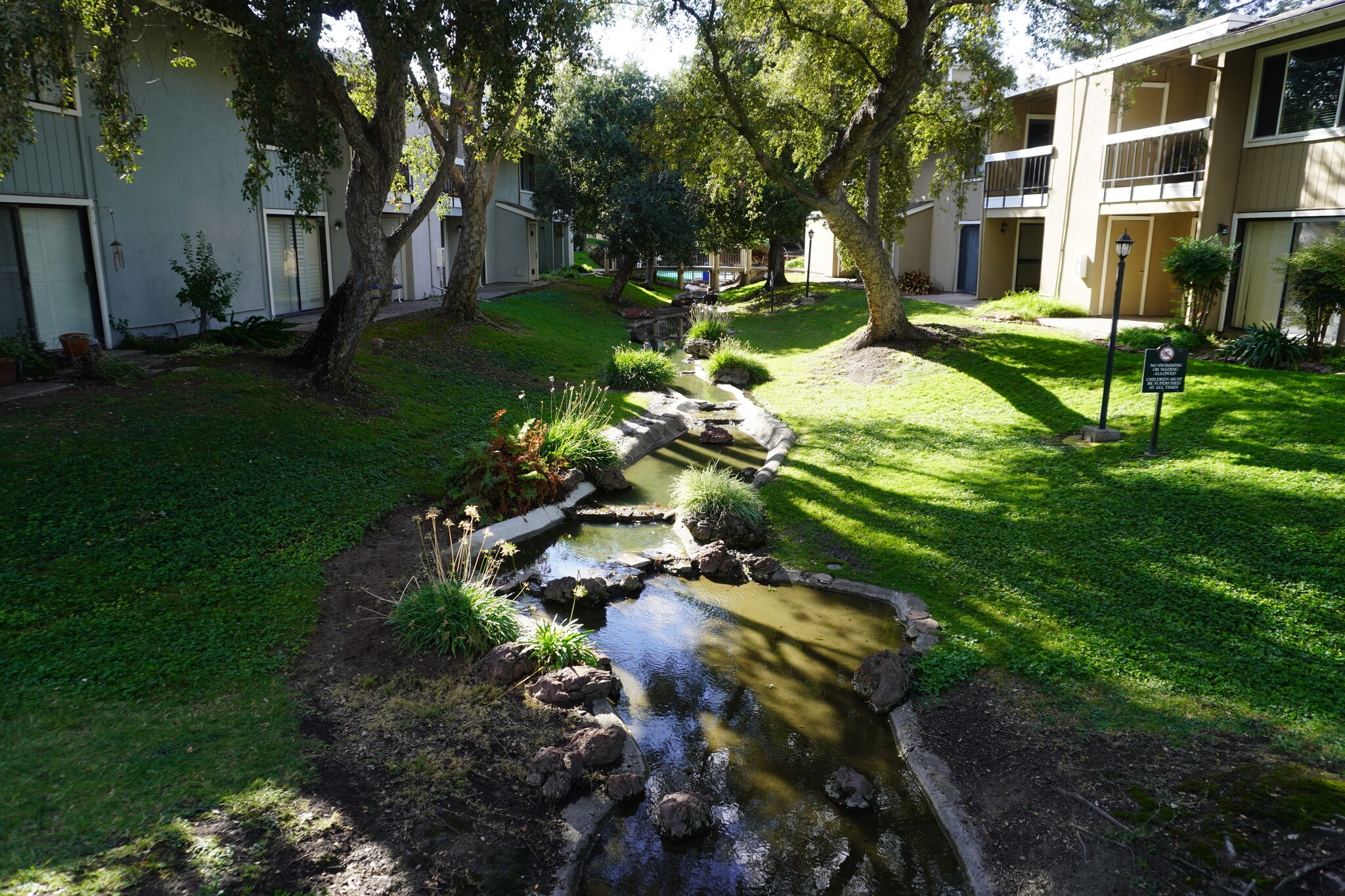 Artificial creek runs through back common area. - 6518 Embarcadero Dr