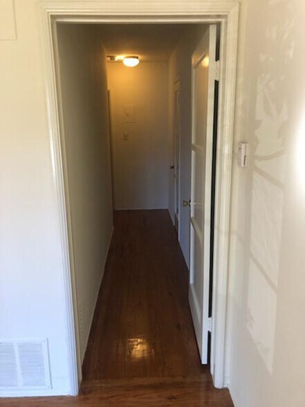 Looking from living room down long hall to bedroom. Large extra closet on the right. - 1237 N Brand Blvd