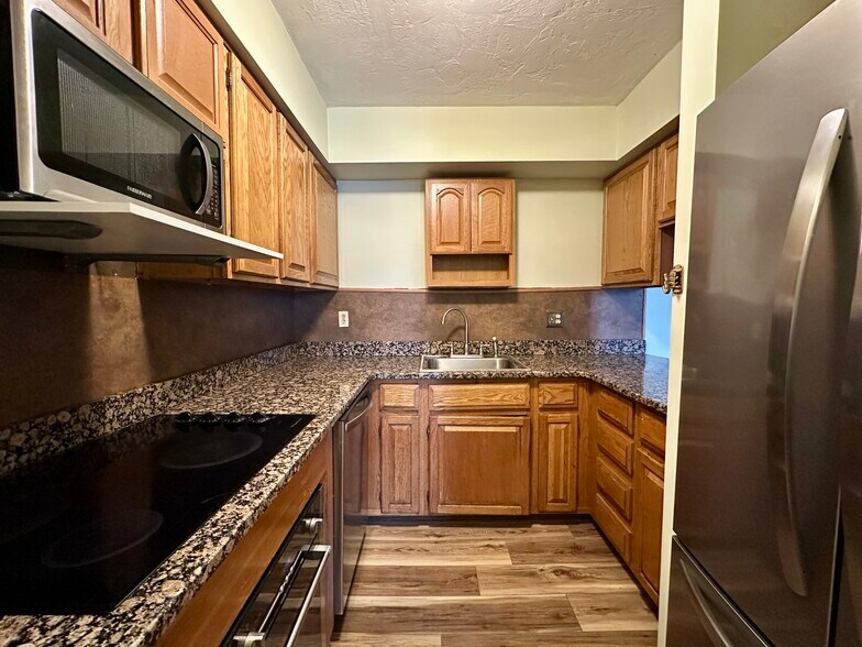 Well-appointed: granite counters. New stainless fridge and dishwasher - 340 Sunderland Rd