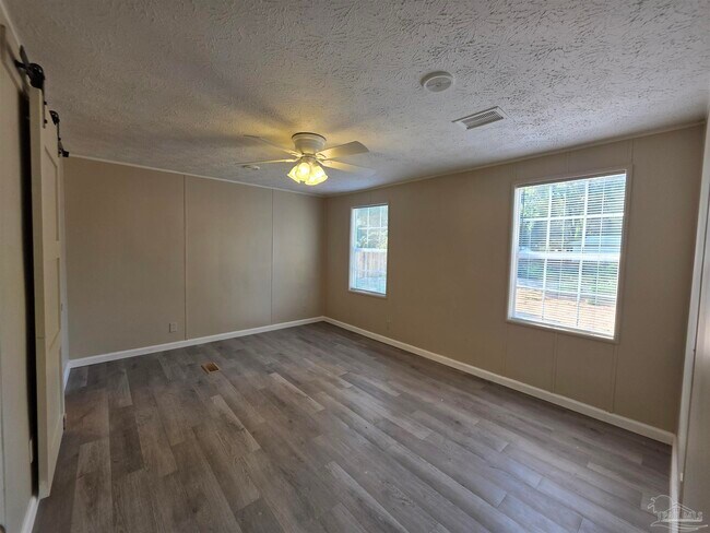 Building Photo - 8906 Figland Ave