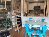 Building Photo - Partially Furnished 1BR condo w/Loft by Ba...