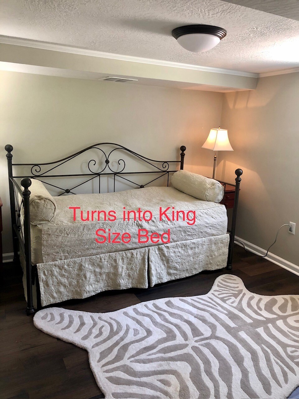 The daybed includes a pop up trundle with mattress that turns into a king size bed. - 469 G St