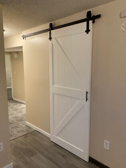 A sliding barn door provides access to your laundry and utility room. - 225 6th St SE