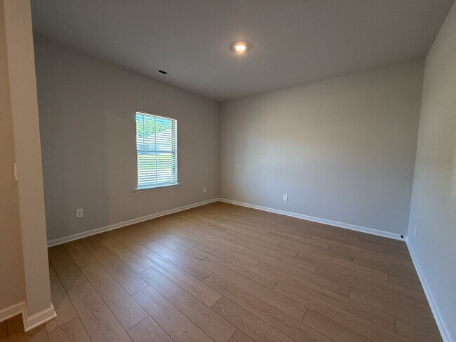 Building Photo - "NEWLY BUILT- Spacious 4-Bedroom Haven with Granite Elegance and Cozy Fireplace in Harvest"