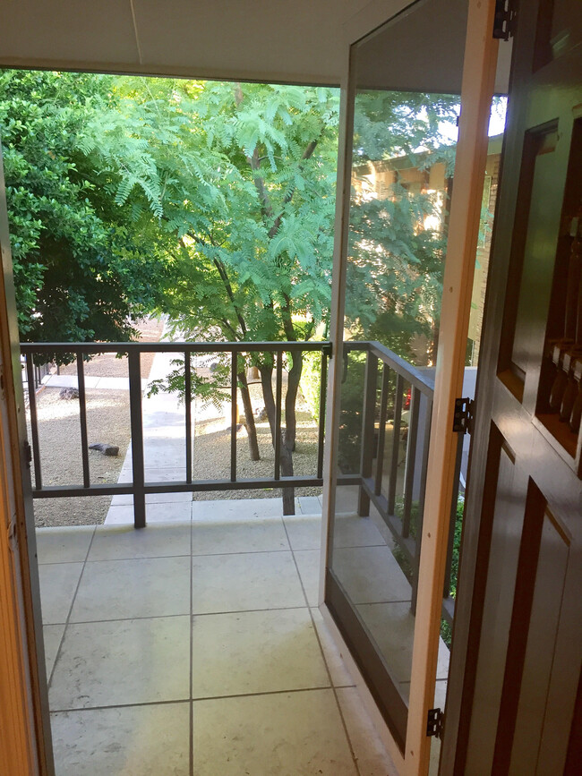 Porch entry to spacious balcony overlooking treed courtyard - 4701 N 68th St